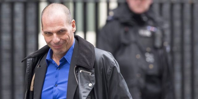 Yanis Varoufakis, Greece's finance minister, left, passes a police officer as he arrives for his meeting with George Osborne, U.K. chancellor of the exchequer, at 11 Downing Street in London, U.K., on Monday, Feb. 2, 2015. Varoufakis said his country won't take any more aid under its existing bailout agreement and wants a new deal with its official creditors by the end of May. Photographer: Jason Alden/Bloomberg via Getty Images