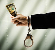 Businessman in Handcuffs Holding Cash Bribe